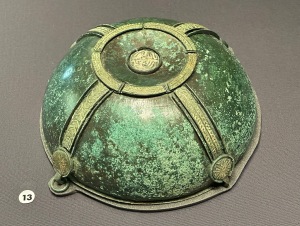 Copper alloy bowl found hanging on its original hook when the chamber was uncovered